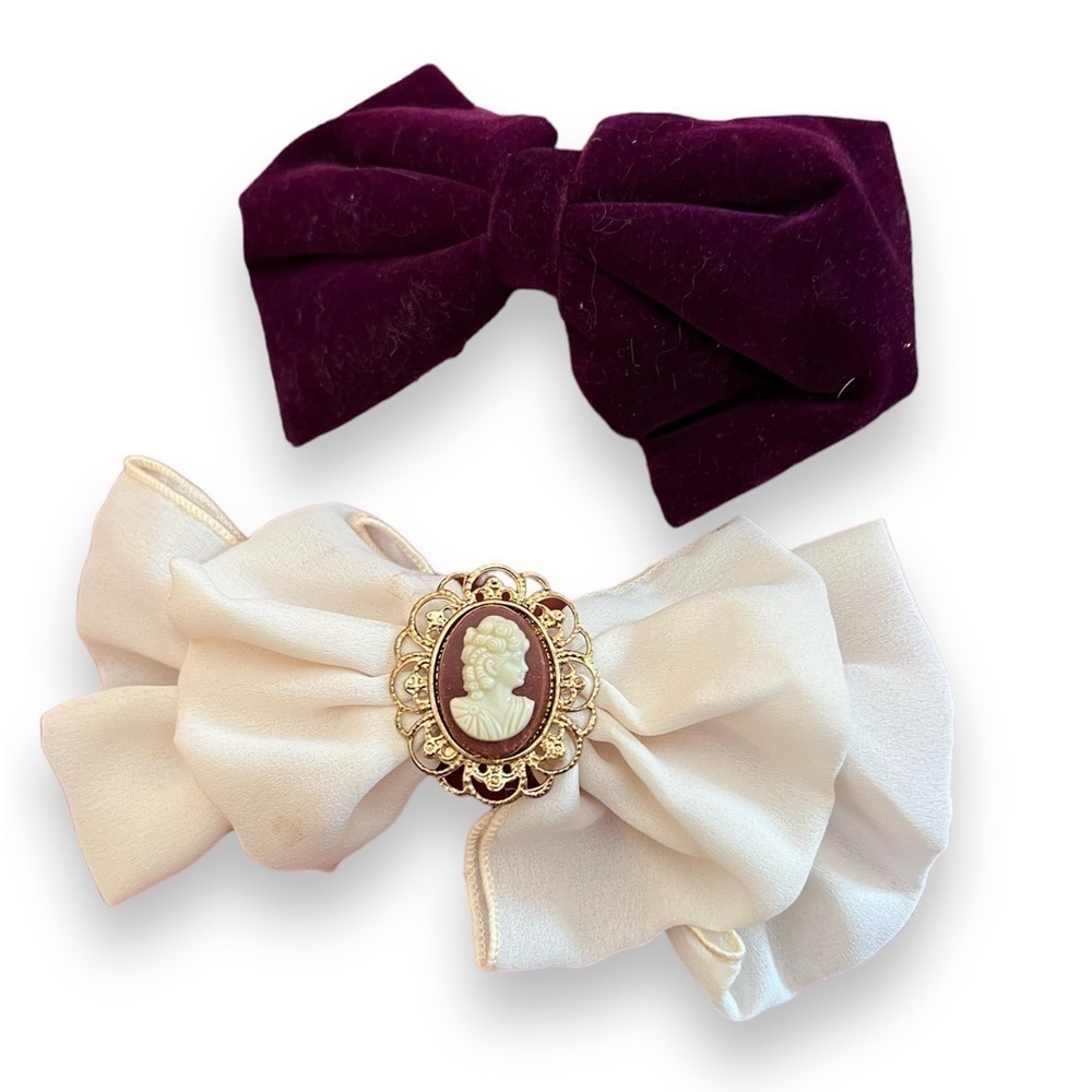 Two beautiful bows, from 90s. One creamy fabric with cameo, other purple velvet.